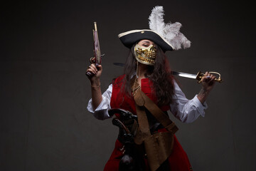 Caribbean female dangerous bandit wearing golden mask