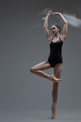 Fitness ballerina showing her perfomance inside studio