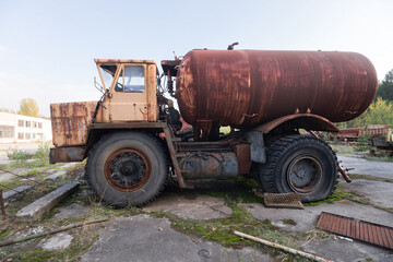 Fototapeta na wymiar Old rusty truck near ghost town Pripyat