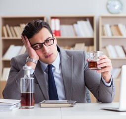 Businessman drinking in the office