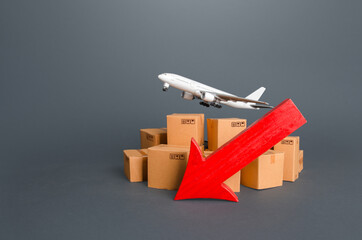 Airplane over boxes and red down arrow. Decline of goods transportation volume, world trade traffic...