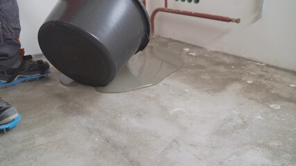 self leveling compound spreading. Self-leveling floor. Self-filling floor. Liquid floor. The...