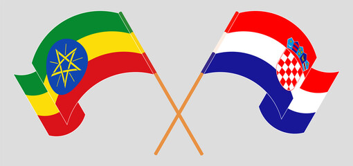 Crossed and waving flags of Ethiopia and Croatia