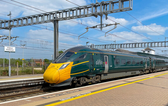 Didcot, England - June 2021: Class 800 high speed train operated by Great Western Railway at Dicot railway station. The front of the locomotive has been painted with a Covid mask.