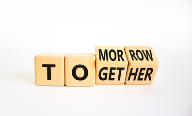Tomorrow we will together symbol. Turned wooden cubes and changed the word together to tomorrow. Beautiful white background, copy space. Business and tomorrow we are together concept. - obrazy, fototapety, plakaty
