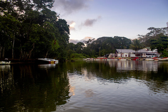 Fishing boats on the banks of the Chuspa river in the Vargas state of Venezuela on a sunny day in front of the coastal mountain