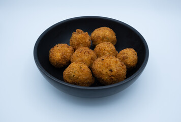 Chicken dumpling in black bowl