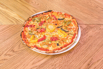 vegetable pizza with peppers, aubergines and ripe zucchini, oregano dough and wheat flour