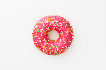 pink donut against white background