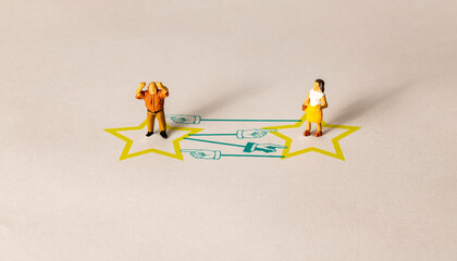 An argument between a couple.  Conceptual image showing miniature people.  