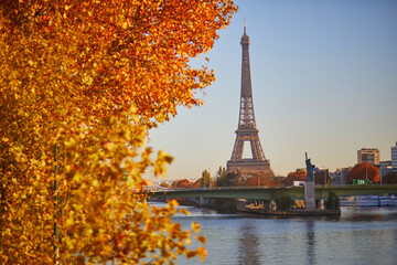 Scenic view of the Eiffel tower over the river Seine from Mirabeau bridge on a bright fall day in Paris