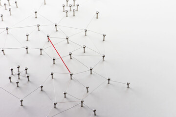Linking entities. Hotline, VPN, tunneling, dedicated line, Network, networking, social media, connectivity, internet communication abstract. Fat red wire in a web of silver wires on white background.
