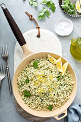 Lemon herb cauliflower rice cooked in a pan