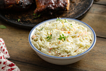 Coleslaw salad served with BBQ meal, traditional side
