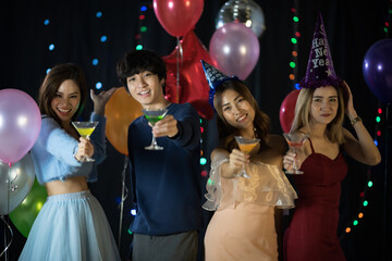 portrait of young people having happiness fun with friendship in new year tradition, smiling with alcohol in birthday party to joy with event in nightclub