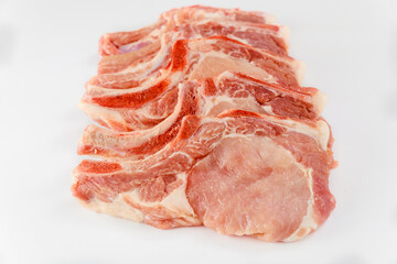 Fresh pork chops bone in isoladet on white background.