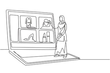 Single continuous line drawing young Arabian woman choosing shopping items on a giant laptop screen. Digital lifestyle with gadgets concept. Dynamic one line draw graphic design vector illustration