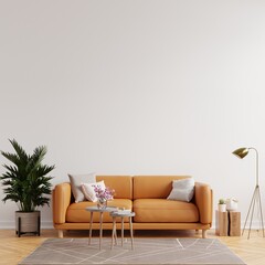 Living room interior wall mockup in warm tones with leather sofa on white wall background.