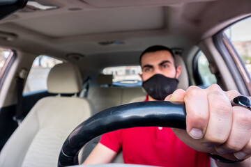 Arabic man driving his car with smile and feeling confident