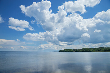 Mille Lacs Lake below dramatic clouds in north central Minnesota on a sunny summer afternoon