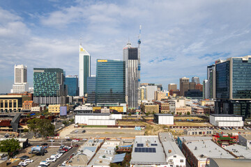 Perth CBD Cityscape with blue cloudy sky. Skyscrapers and industrial buildings