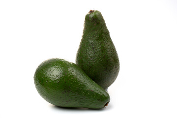 Two Avocadoes whole fruit isolated on a white background