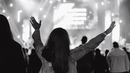 christian concert woman raised hands - obrazy, fototapety, plakaty
