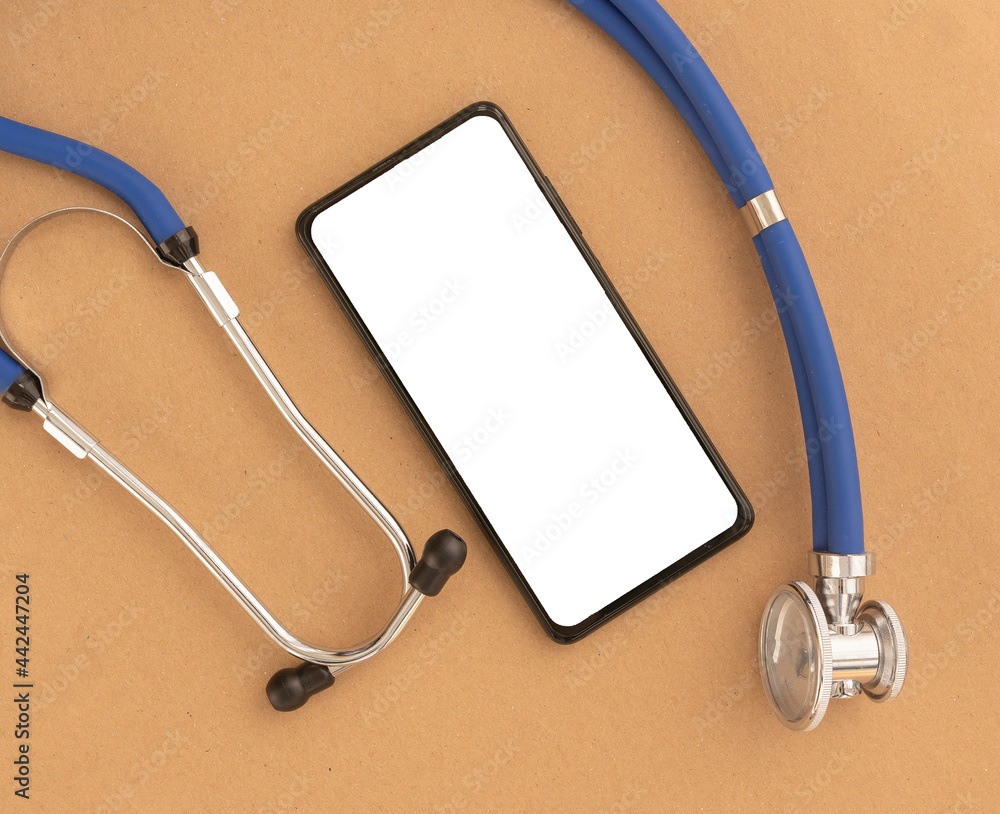 Poster Mobile phone mockup with sthethoscope and white screen. Template mock up on smartphone at desk for medical app.