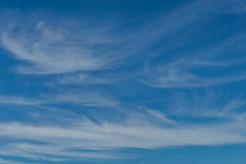 Wispy clouds with a ultramarine sky