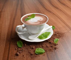 hot chocolate cafe mocha drink with mint leaf in beautiful England white cup hot coffee beverage...