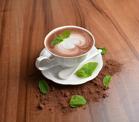 hot chocolate cafe mocha drink with mint leaf in beautiful England white cup hot coffee beverage menu