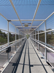 interior of a bridge with lines forming a tunnel, tunnel concept