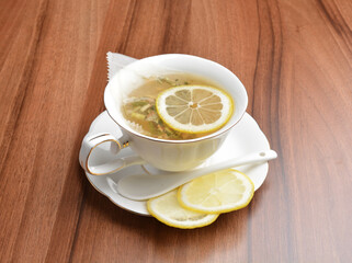 hot ginger lemon fruit tea bag drink in beautiful England design white cup hot healthy beverage menu