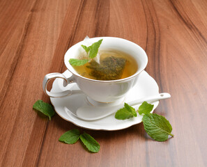 hot moroccan mint leaf tea bag drink in beautiful England design white cup hot healthy beverage menu