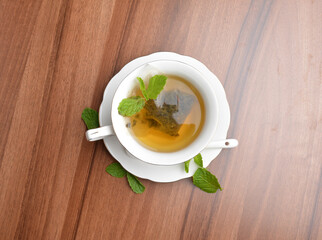 hot moroccan mint leaf tea bag drink in beautiful England design white cup hot healthy beverage menu