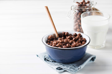 Round cocoa flakes in a bowl. Dry breakfast.