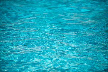 Tansparent clear calm water surface texture. Abstract nature background. Sea water pattern.