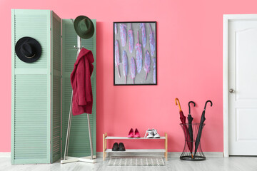 Interior of stylish hallway with modern folding screen