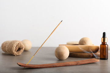 Incense stick and spa supplies on table