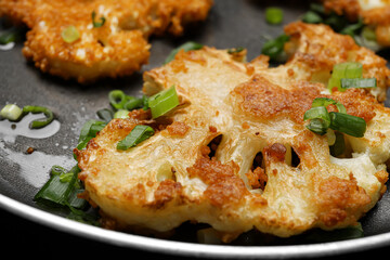 Frying pan with tasty fried cauliflower, closeup