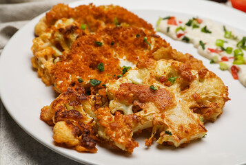 Plate with tasty fried cauliflower and sauce, closeup