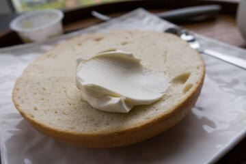 a plate of Bagel with Cream Cheese and Coffee.