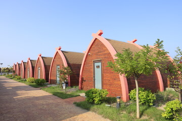 Wooden houses on the water,  log cabins by the sea