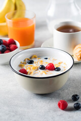 Cornflakes with berries and milk. Dry breakfast.