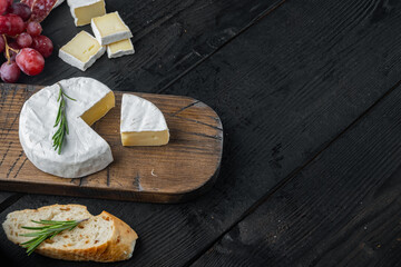 Farm cheese camembert  , on black wooden table  with copy space for text
