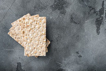 Wholegrain Rye Crispbread cracker, on gray stone table background, top view flat lay, with copy...
