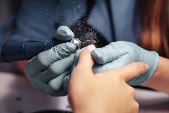 Manicure master makes nails woman in beauty salon © Alex Vog
