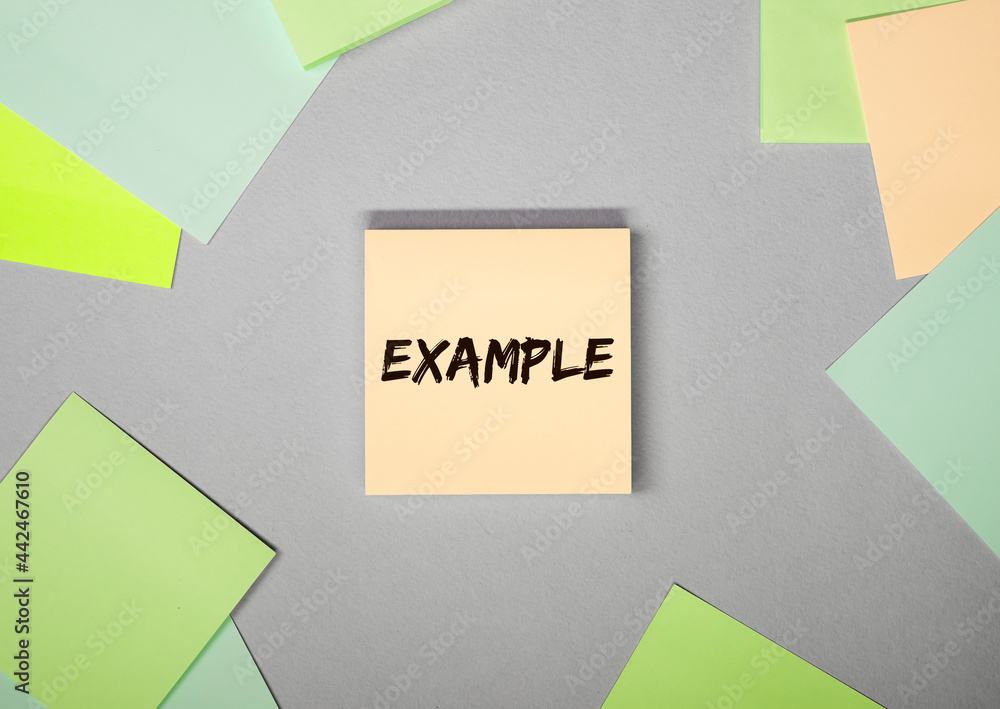 Poster example word on sticky note on grey background.