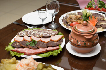 Meat appetizer of smoked beef, horse meat, turkey on the banquet table