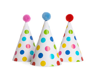 Bright birthday party hats on white background